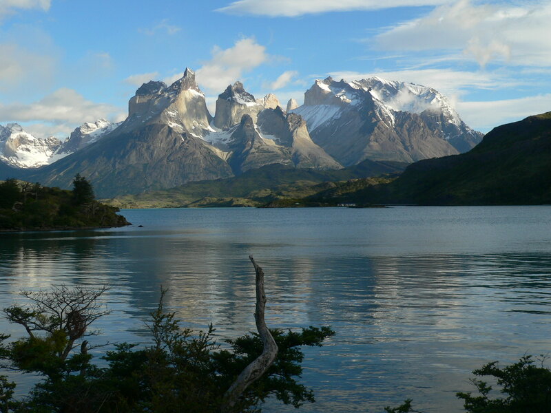 Snow-capped mountains by a lake