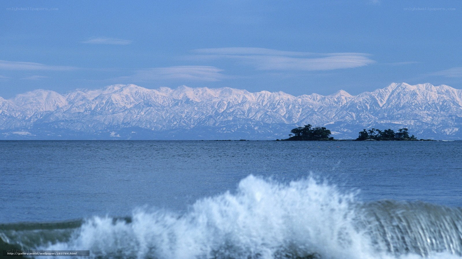Snow-capped mountains by the sea
