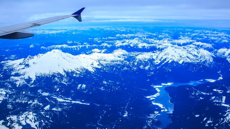 Snow-capped Mountains from Plane — Blue