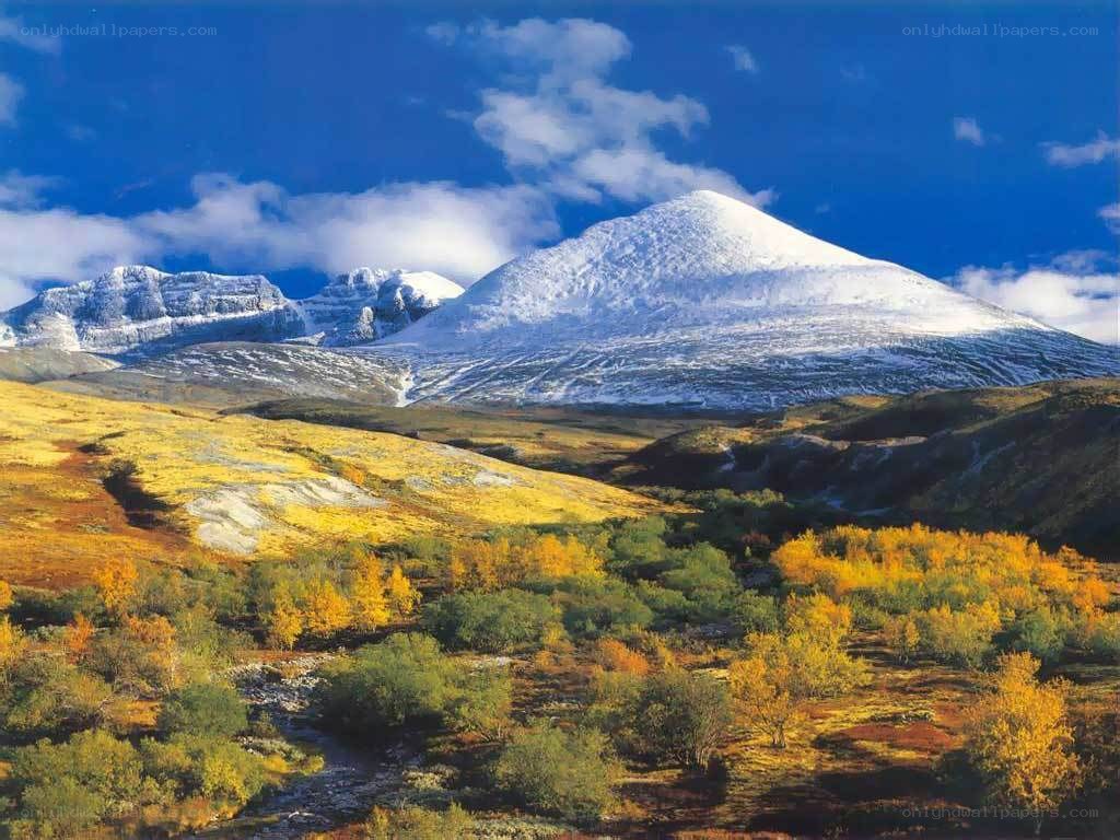 Snow-capped mountains in autumn