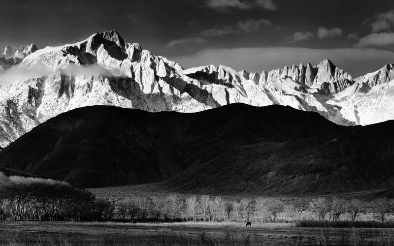Snow-capped mountains in black and white