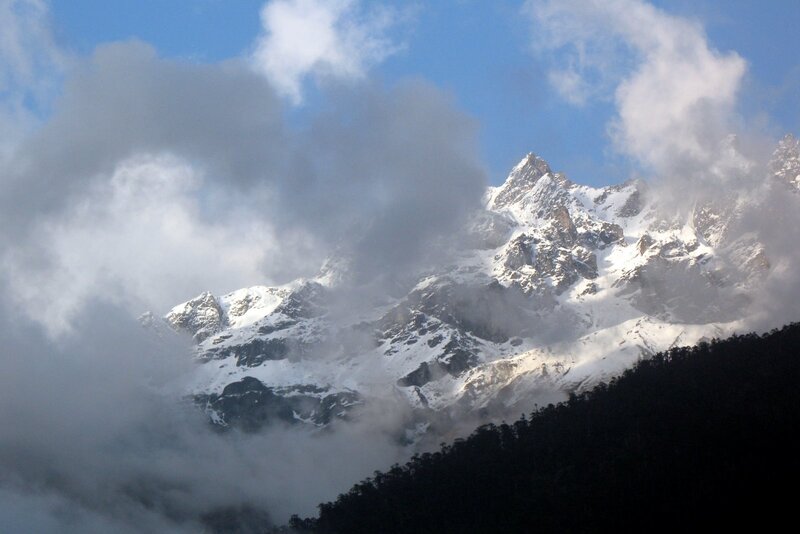 snow-capped mountains in clouds