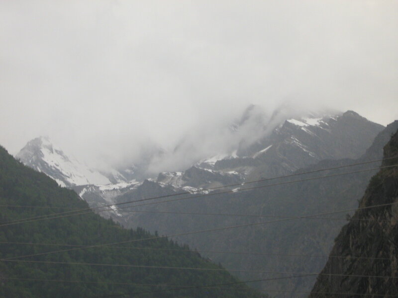 snow-capped mountains in fog