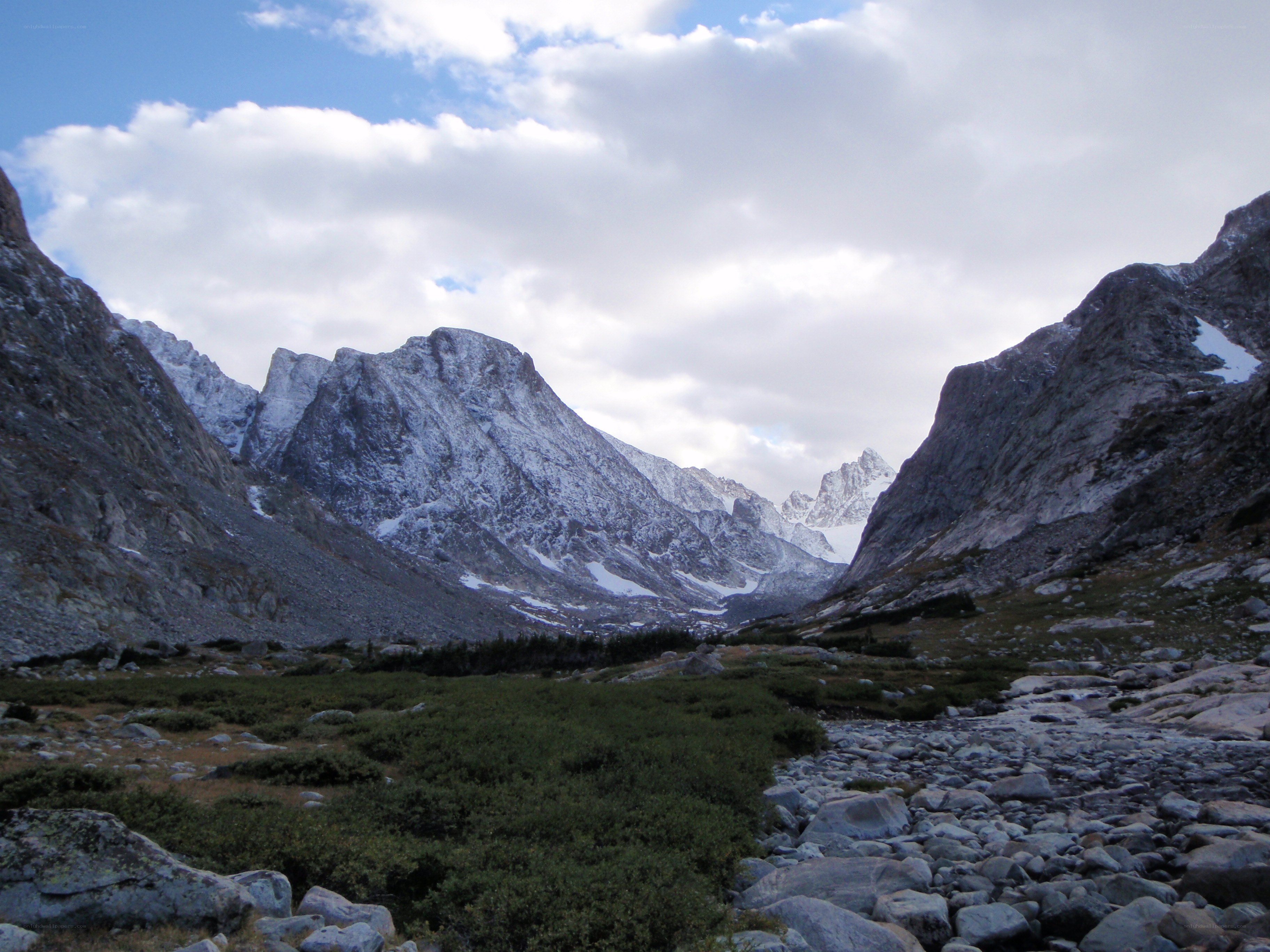 snow-capped mountains in valley