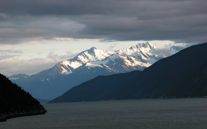 snow-capped mountains over a fjord