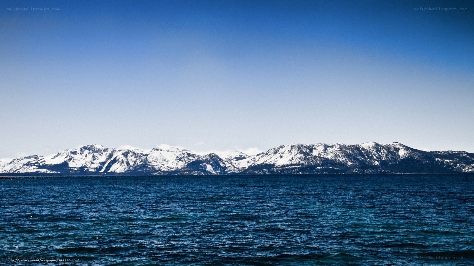 Snow-capped mountains over a lake