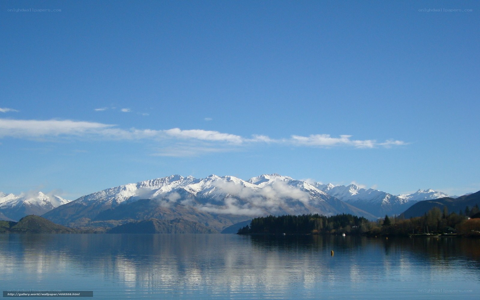 Snow-capped mountains over a lake