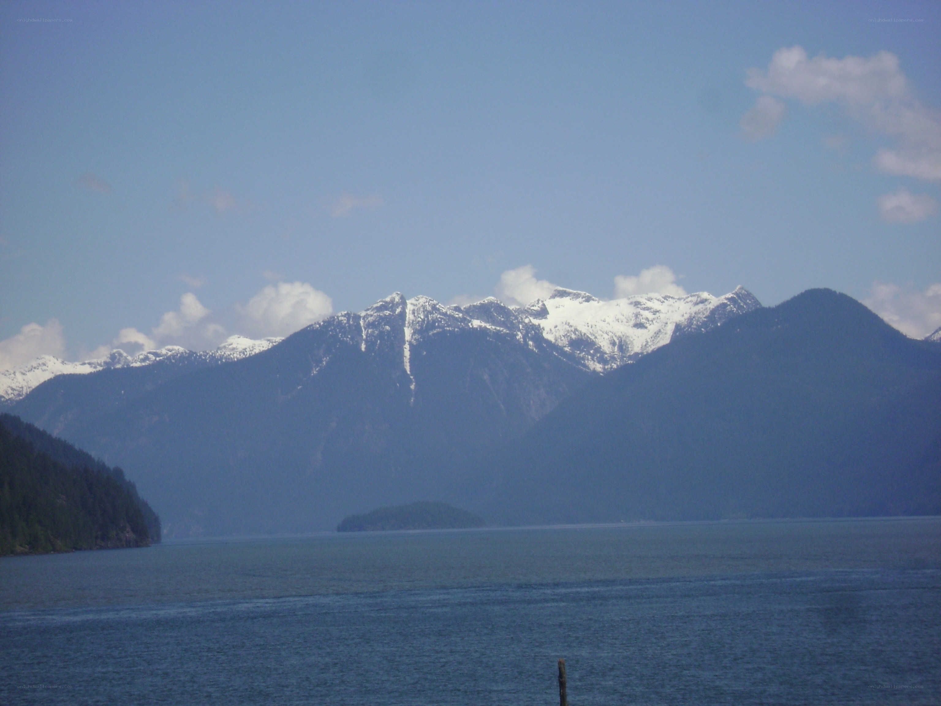 snow-capped mountains over a lake
