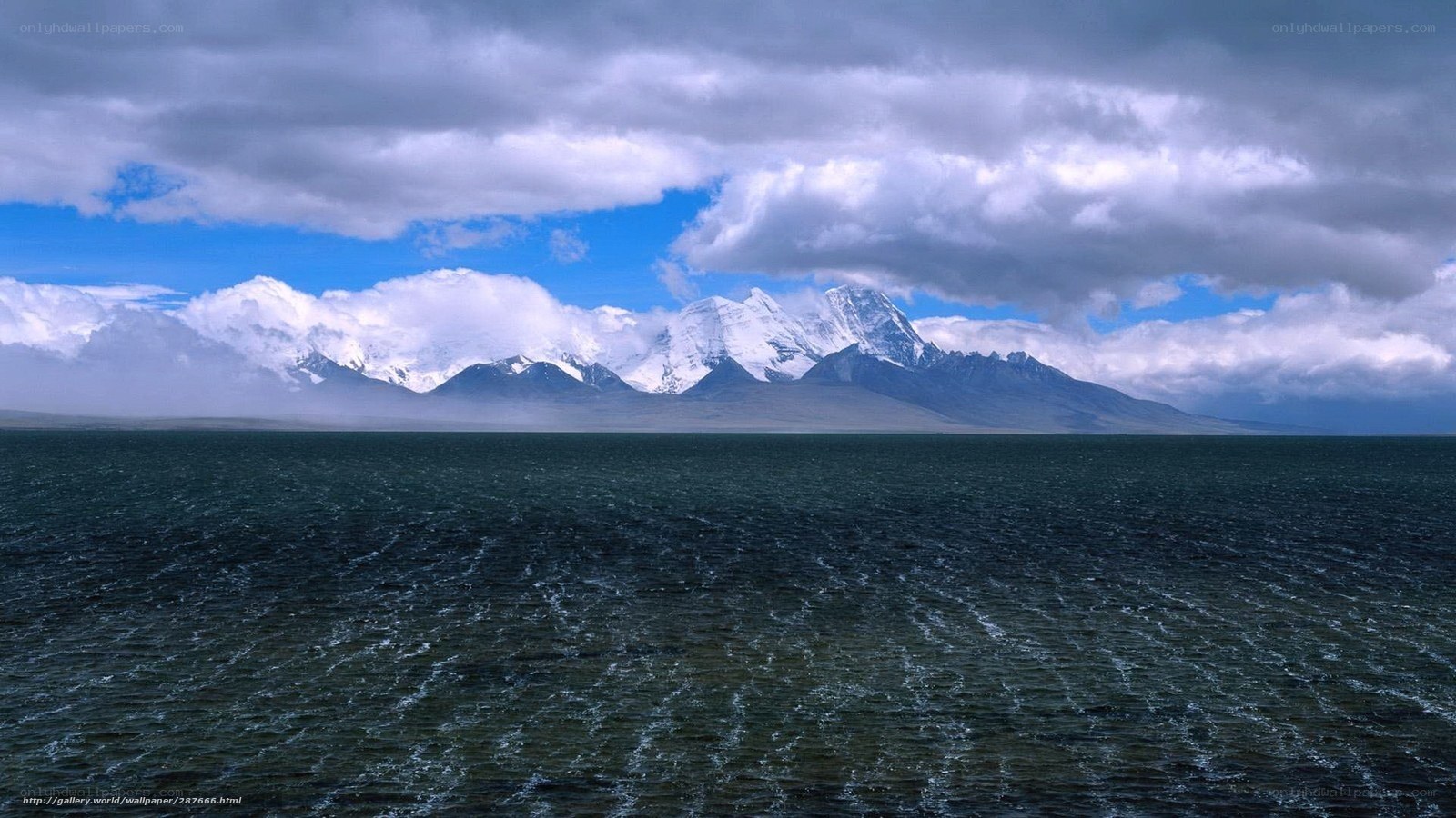 Snow-capped mountains over a lake