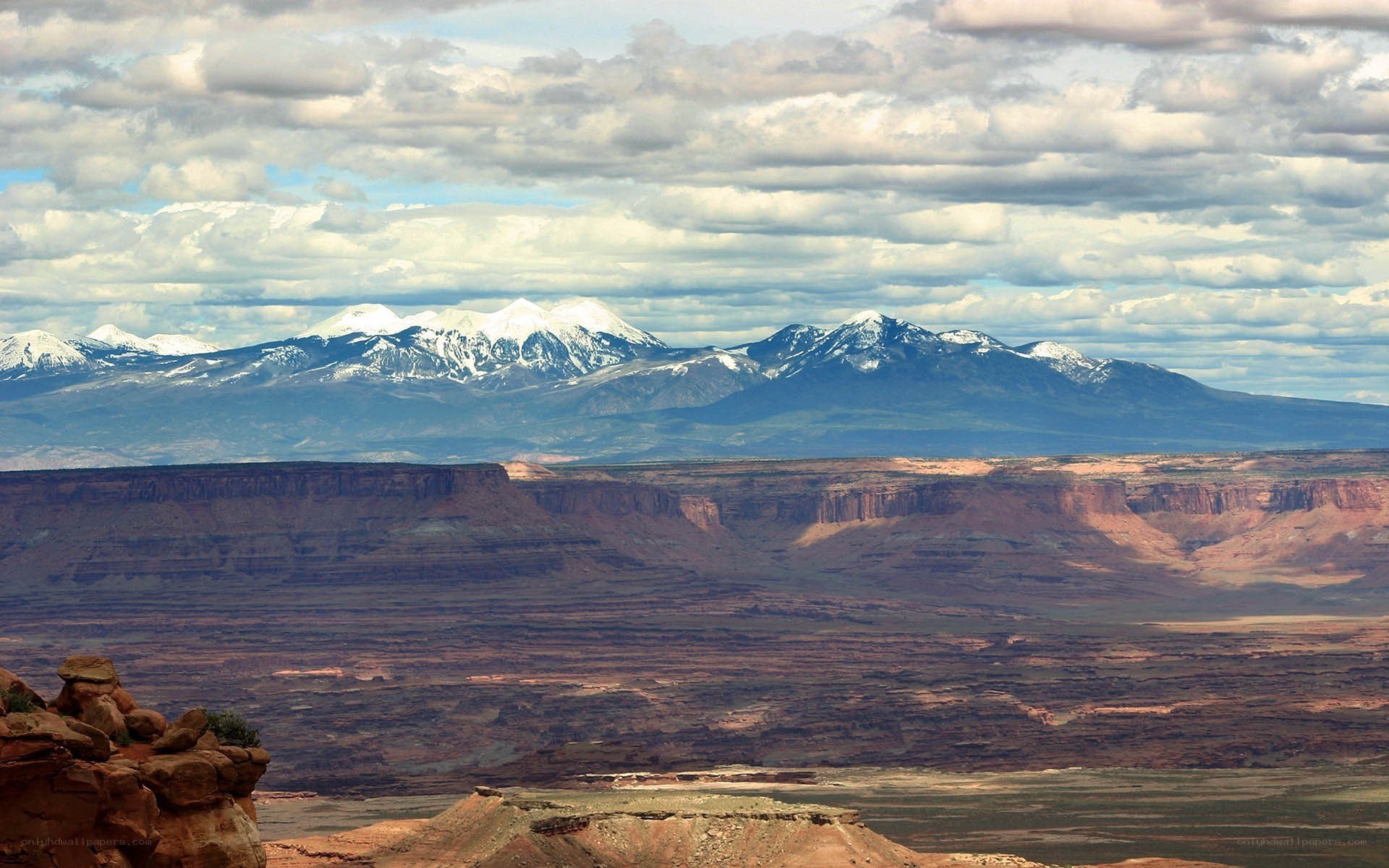 Snow-capped mountains over canyon