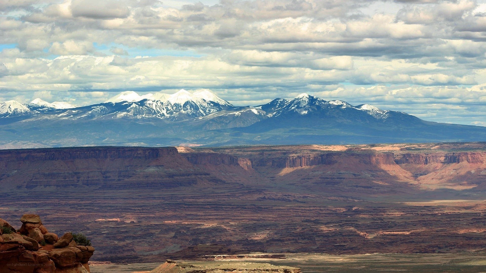 snow-capped mountains over canyon