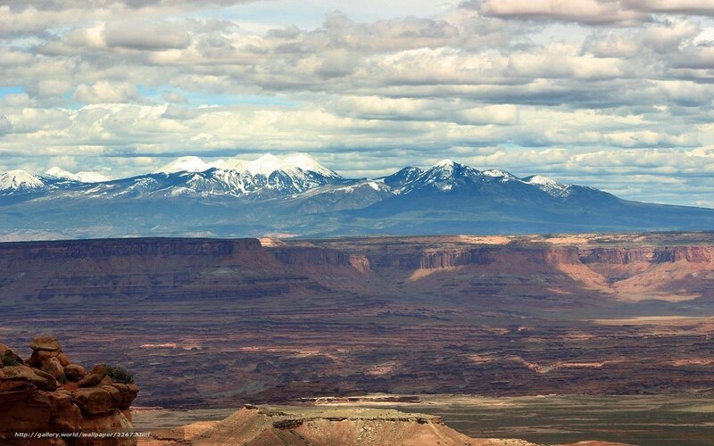 Snow-capped mountains over canyon