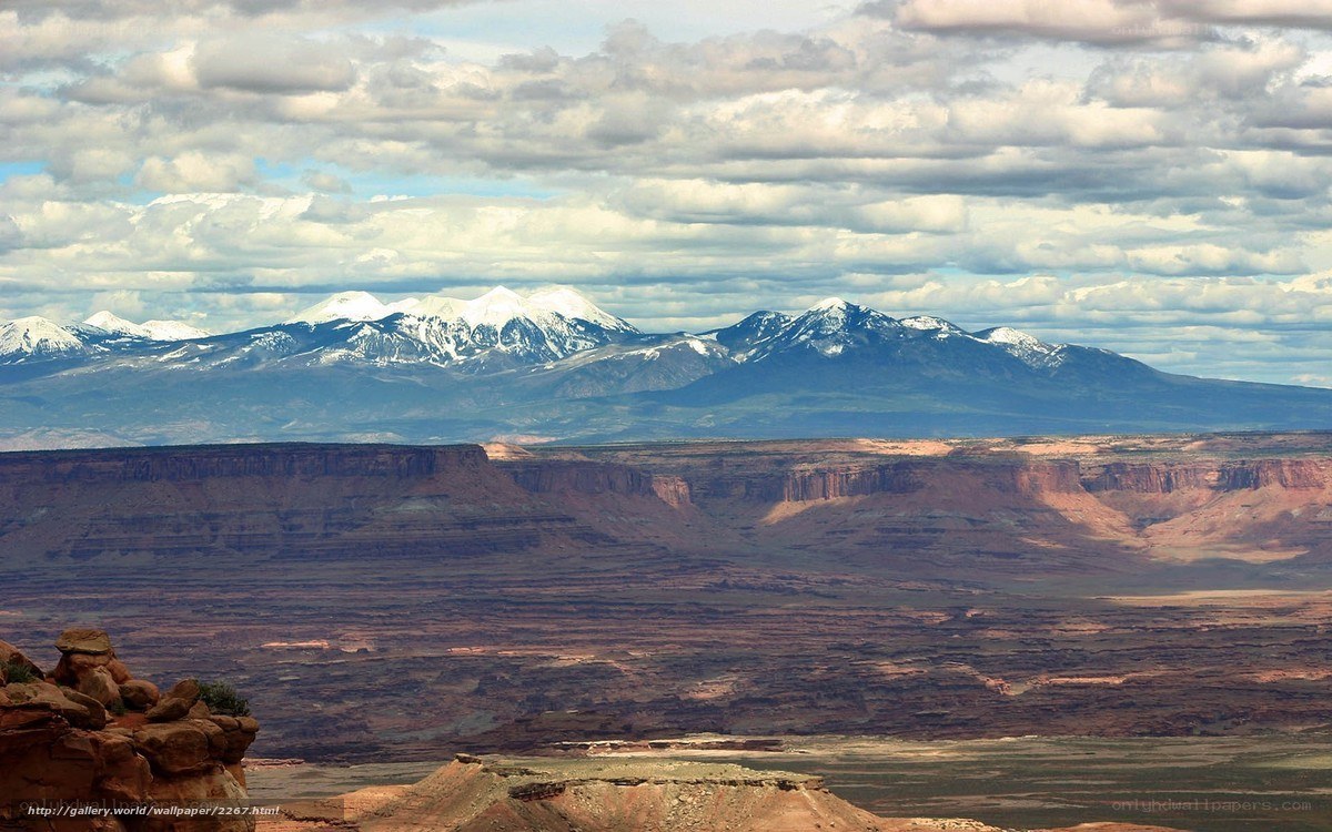 Snow-capped mountains over canyon