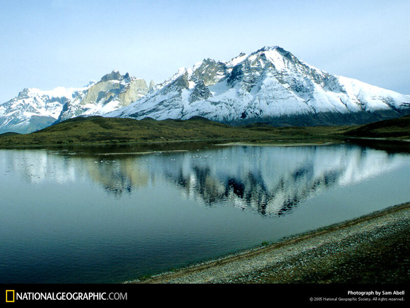 Snow-capped mountains reflected in a lake