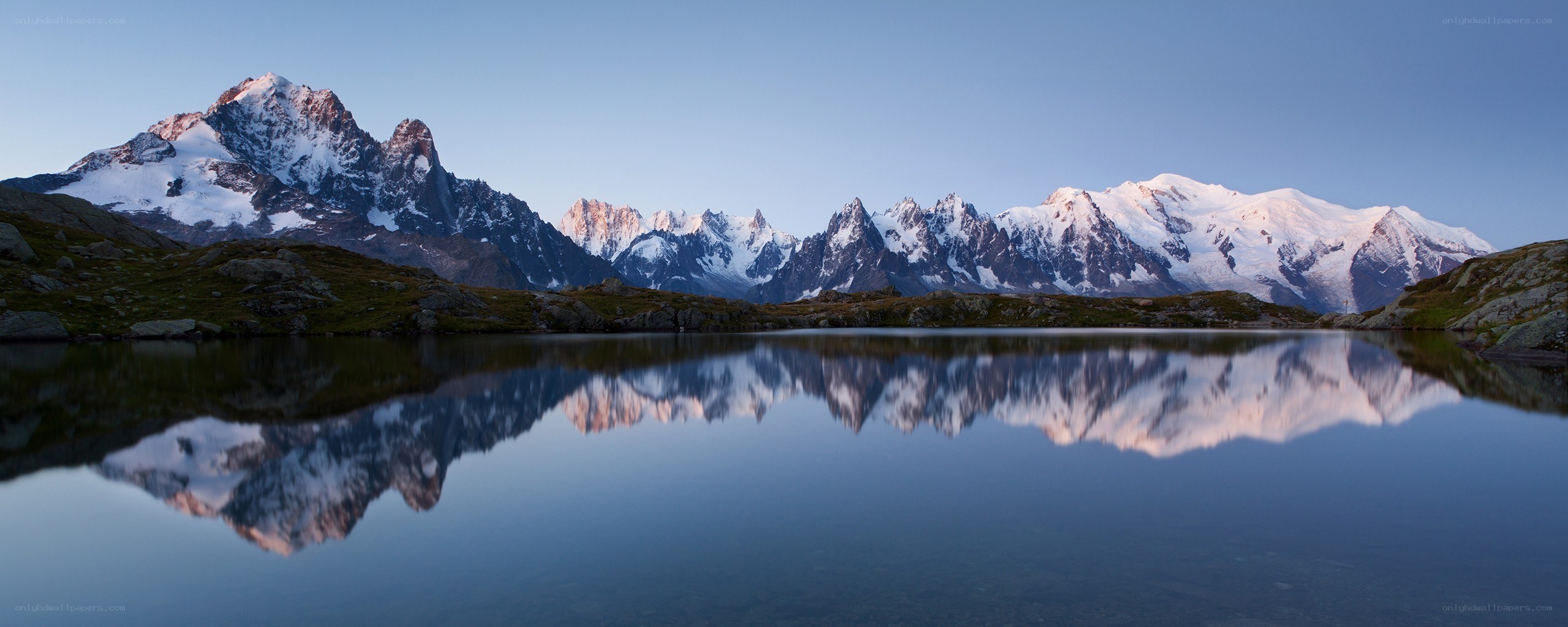 Snow-capped mountains reflected in a lake