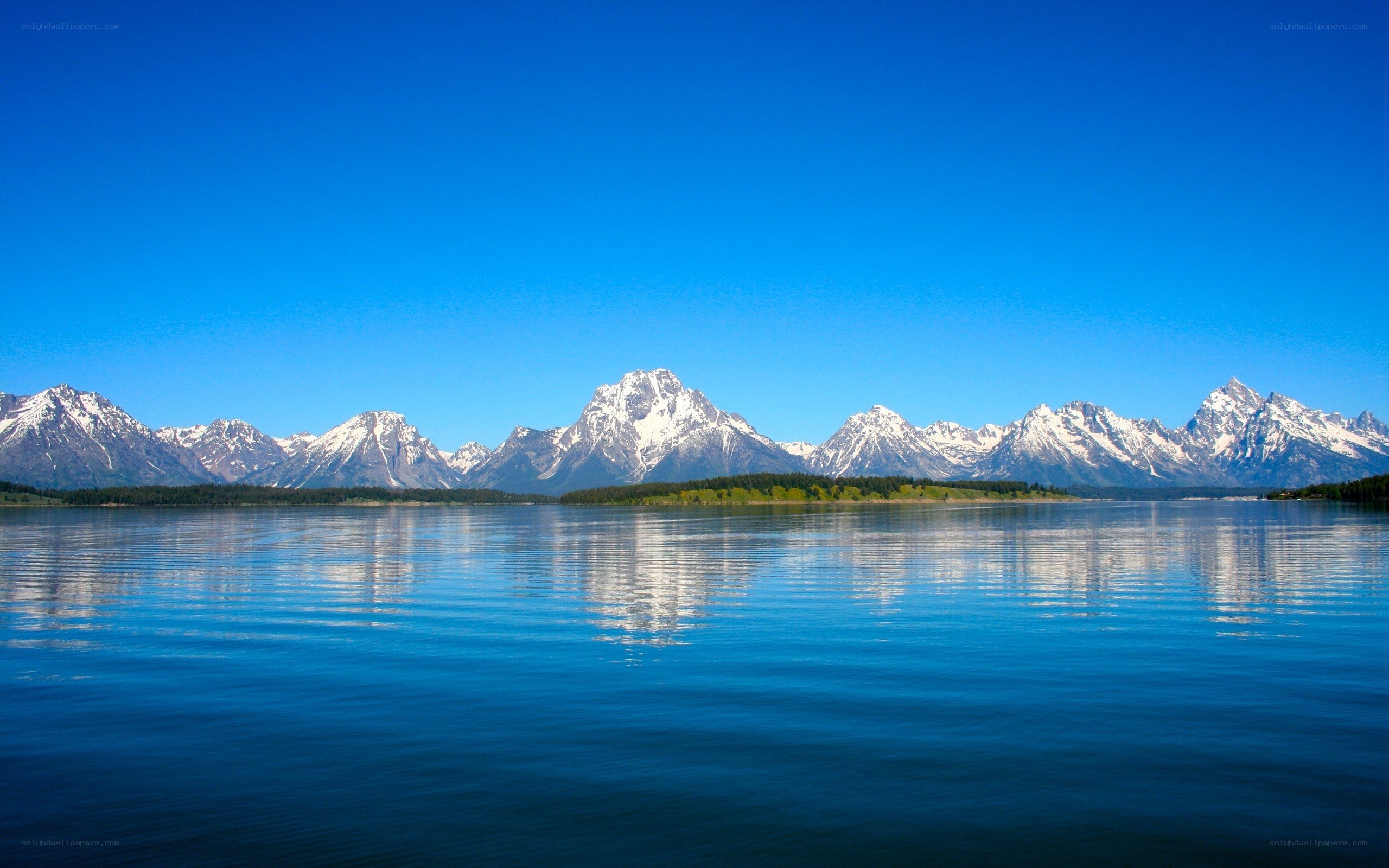 snow-capped mountains reflected in a lake