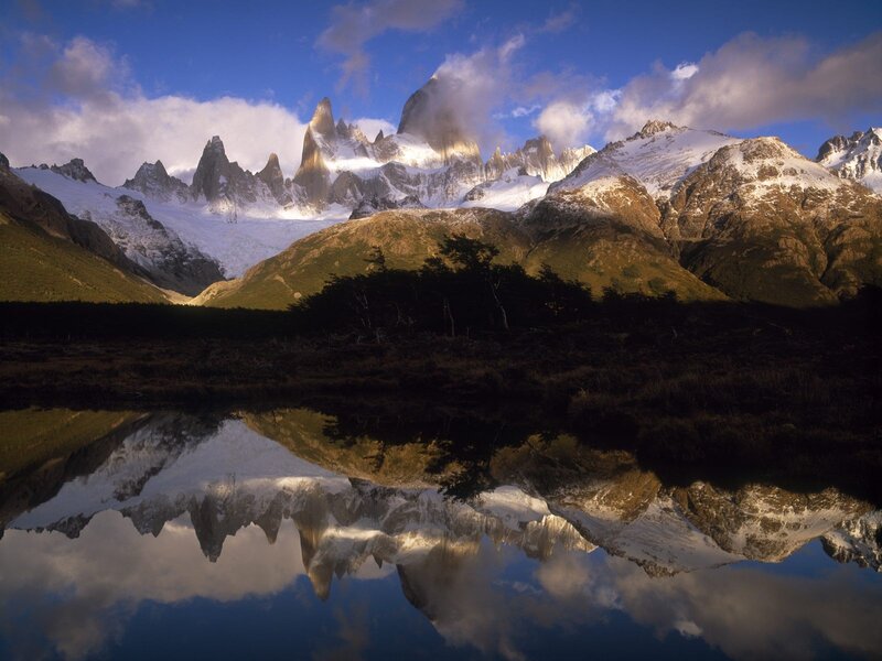 Snow-capped mountains reflected in a lake