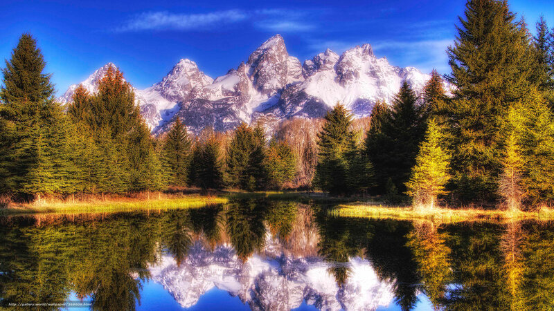 Snow-capped mountains reflected in a lake