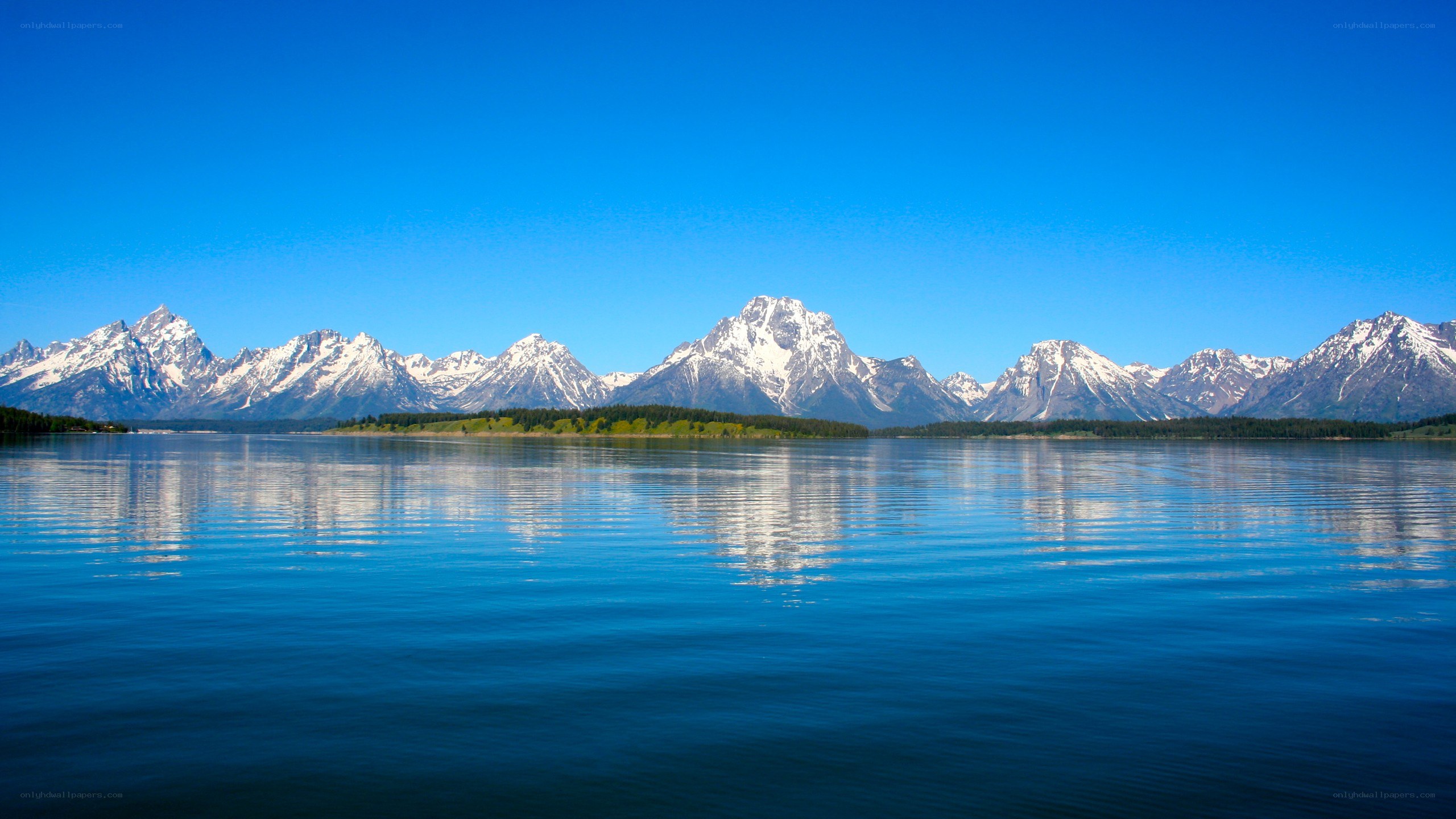 snow-capped mountains reflected in a lake