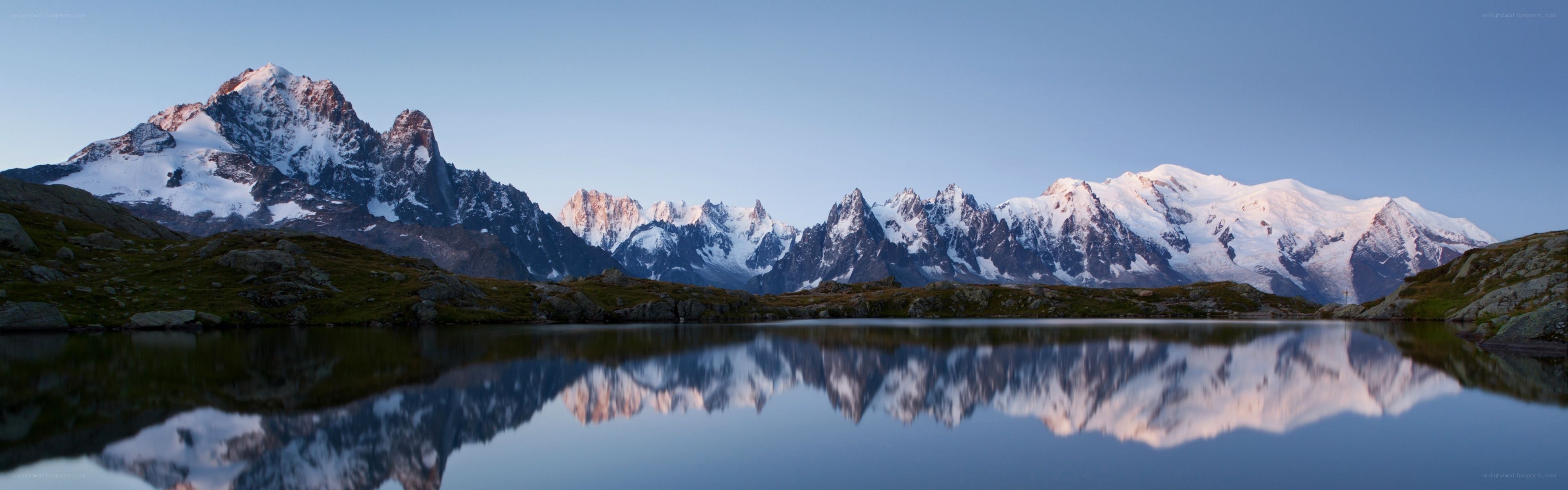 Snow-capped mountains reflected in a lake