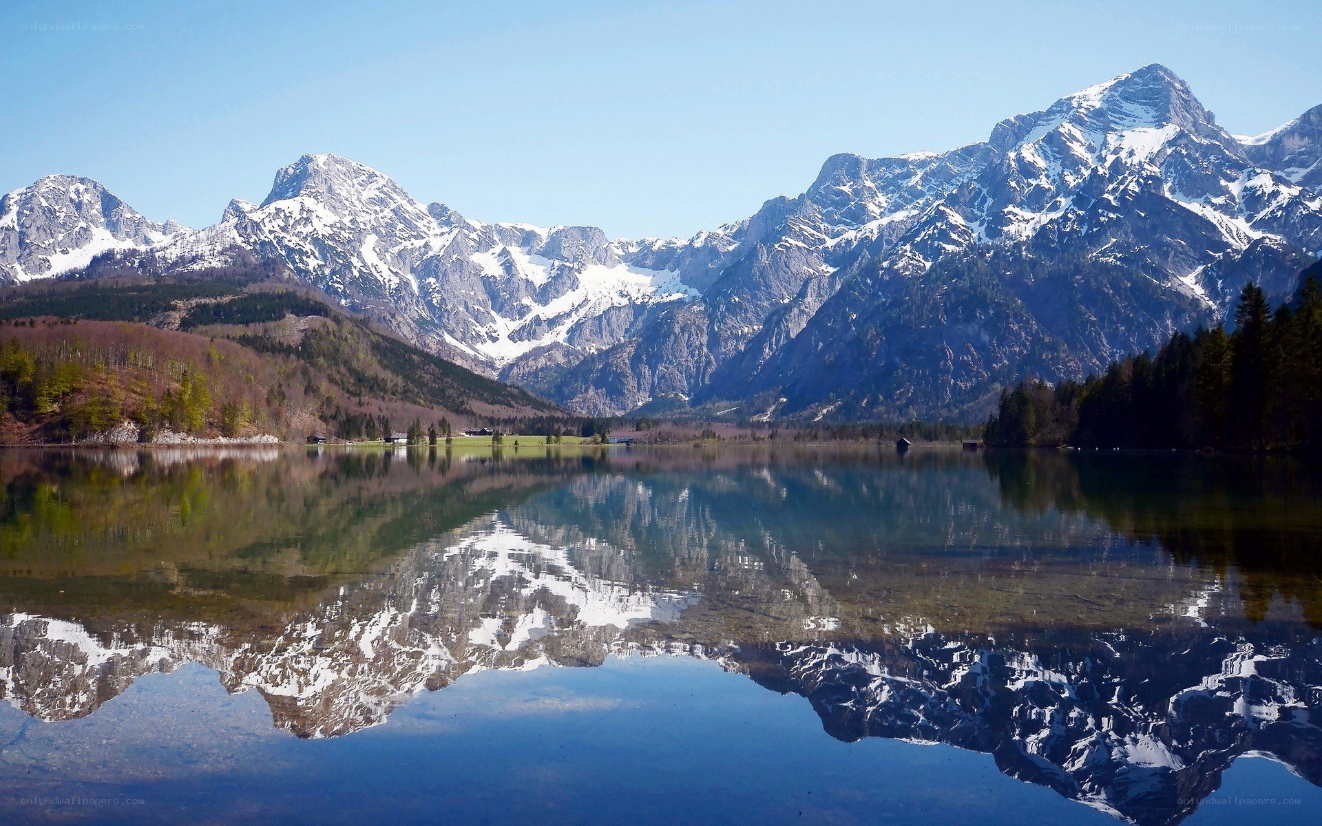 Snow-capped mountains reflected in a lake