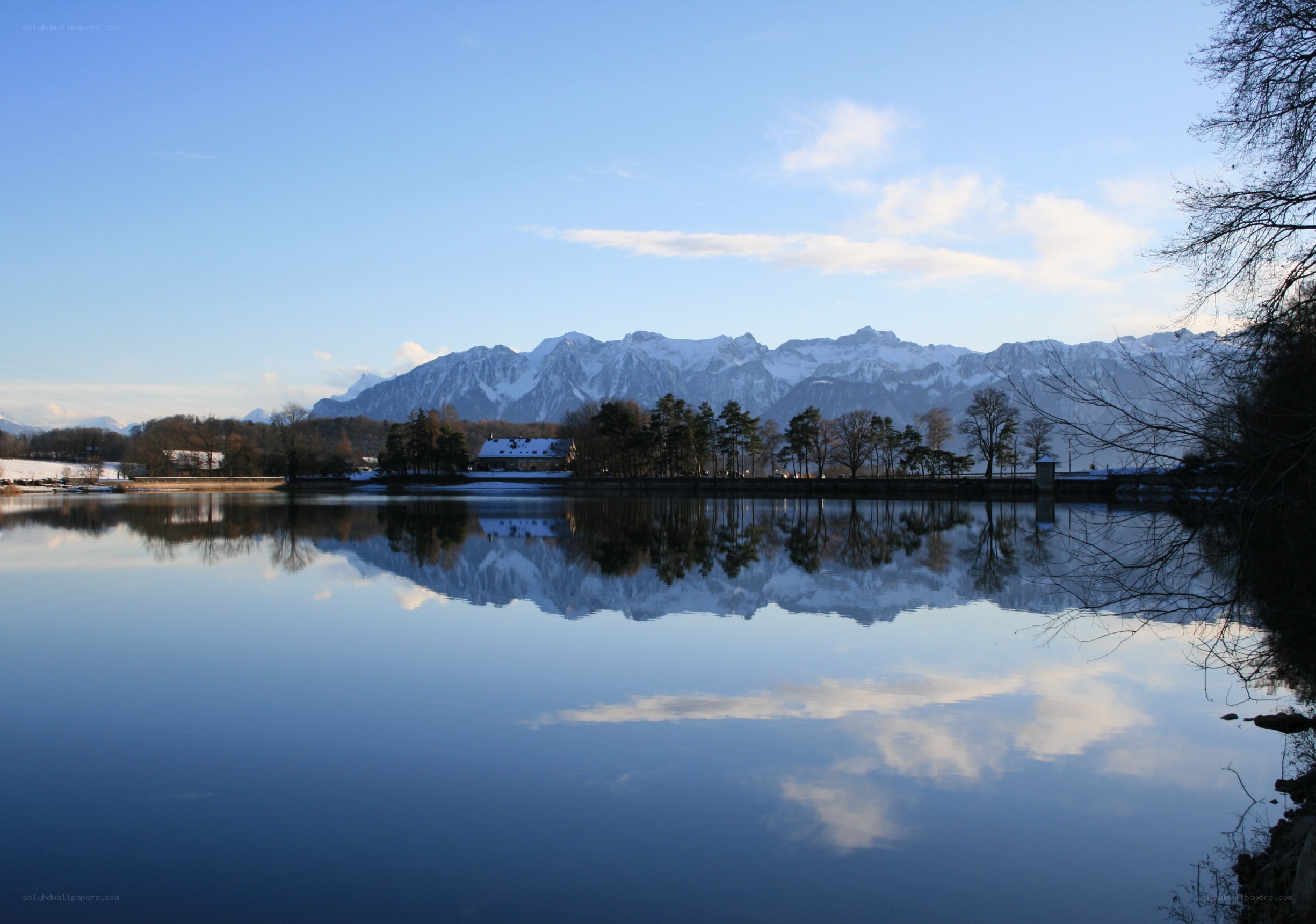 Snow-capped mountains reflected in a lake