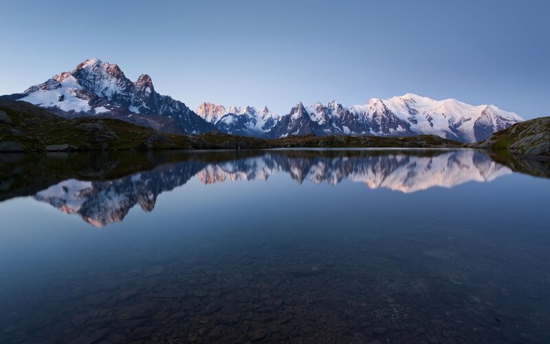 Snow-capped mountains reflected in a lake