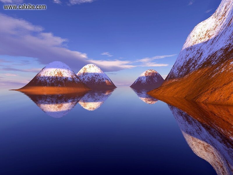 Snow-capped mountains reflected in water