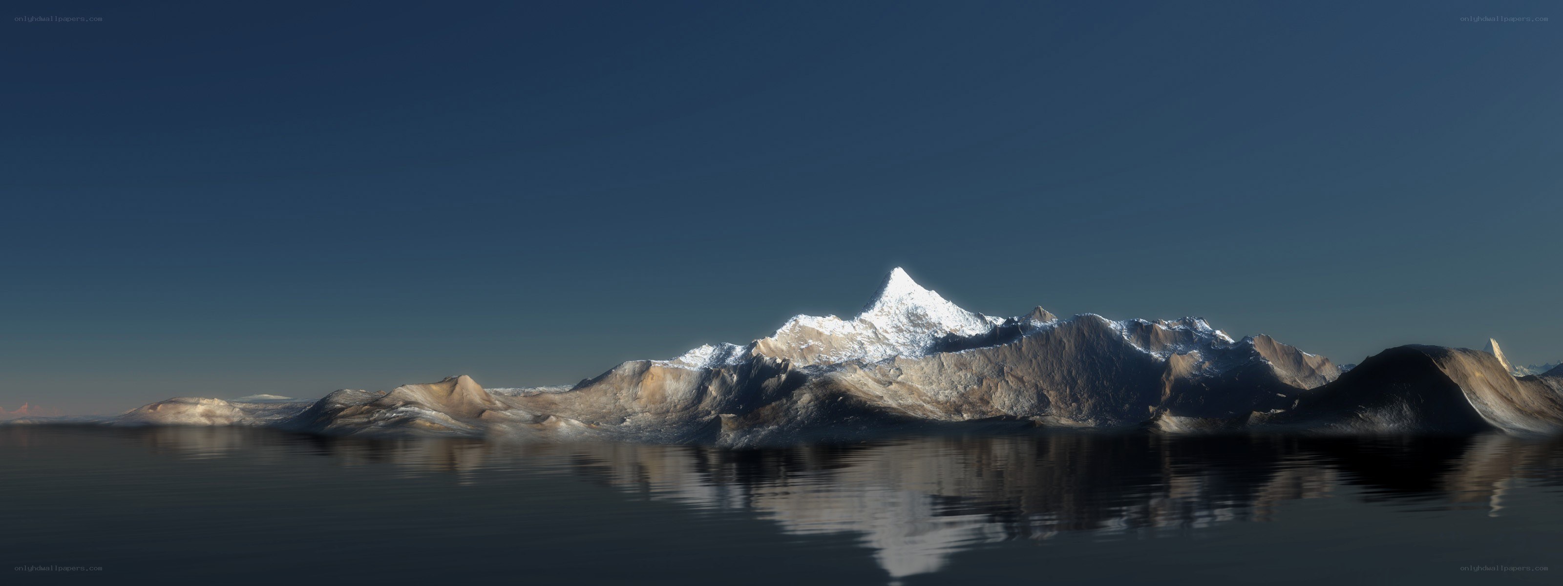 snow-capped mountains reflected in water