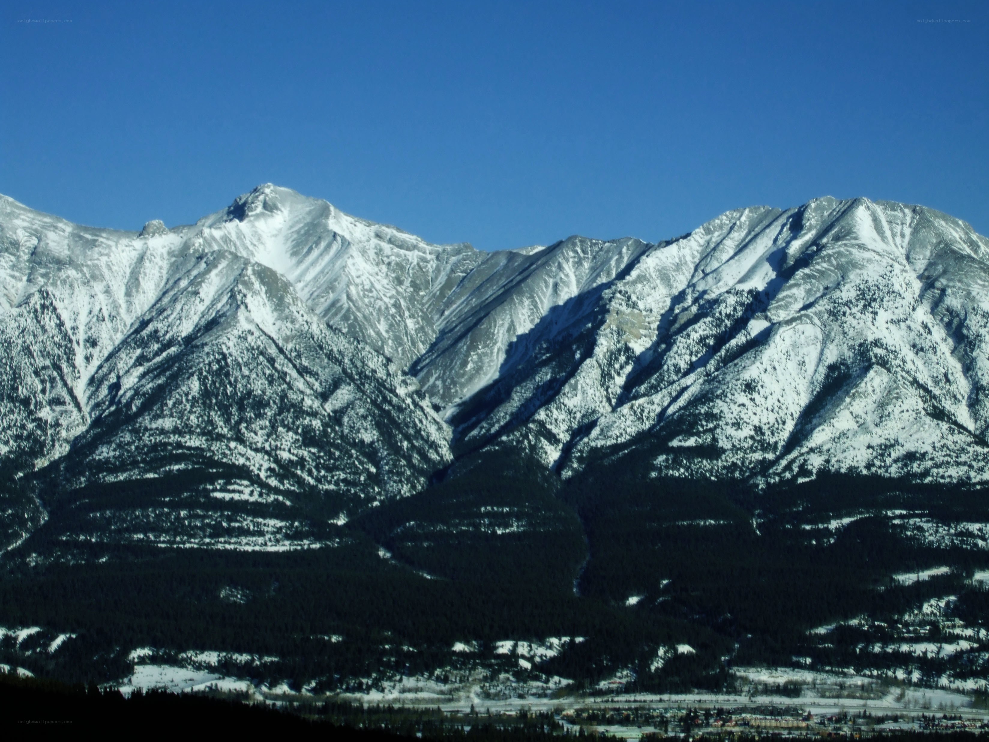 snow-capped mountains under blue sky