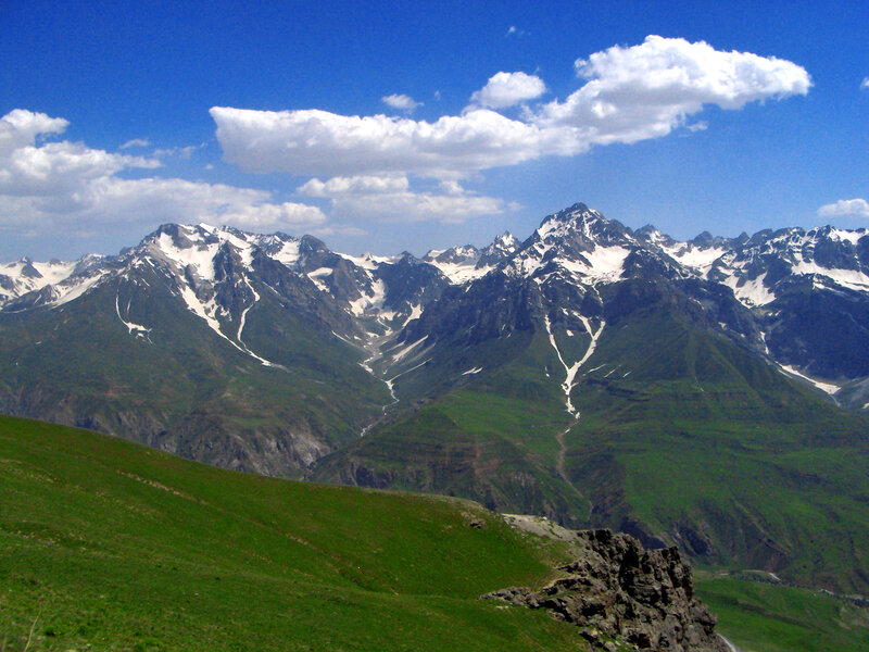 snow-capped mountains under blue sky