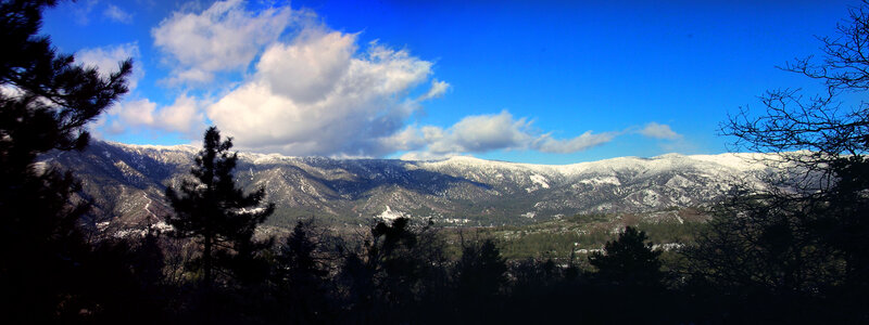 Snow-capped mountains under blue sky