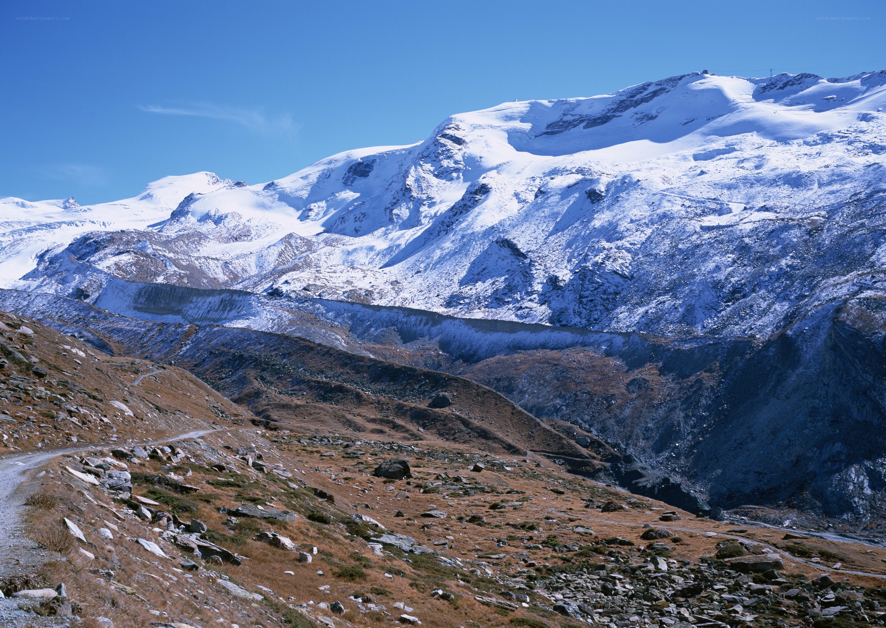 snow-capped mountains under blue sky