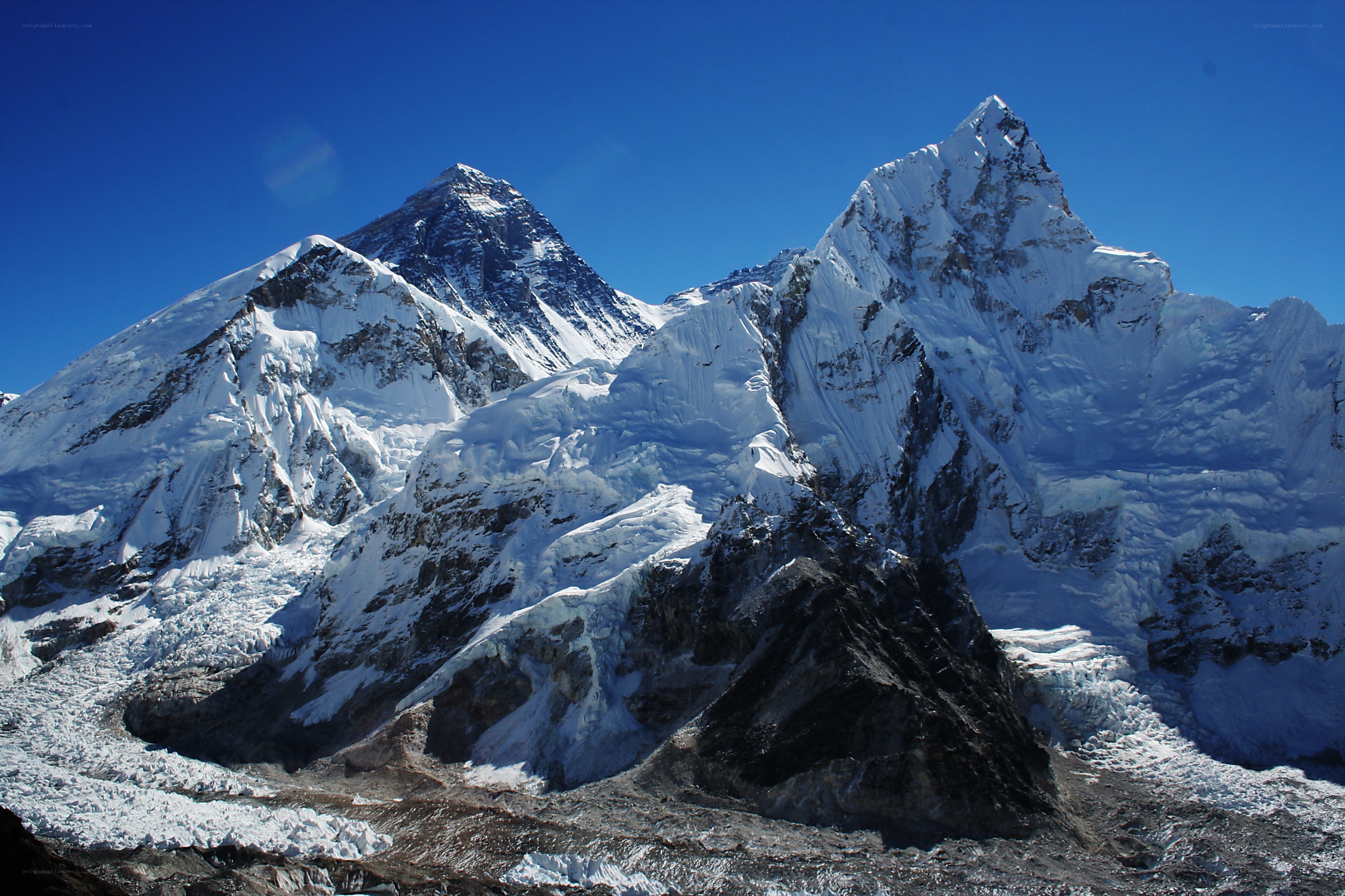 snow-capped mountains under blue sky