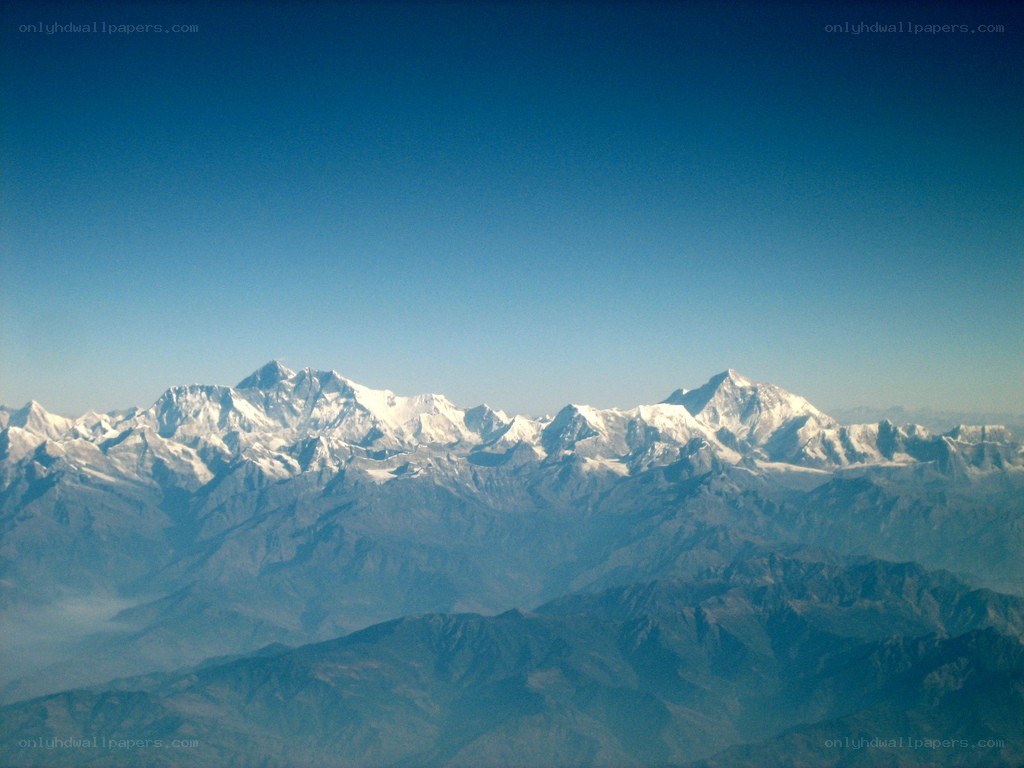 snow-capped mountains under blue sky