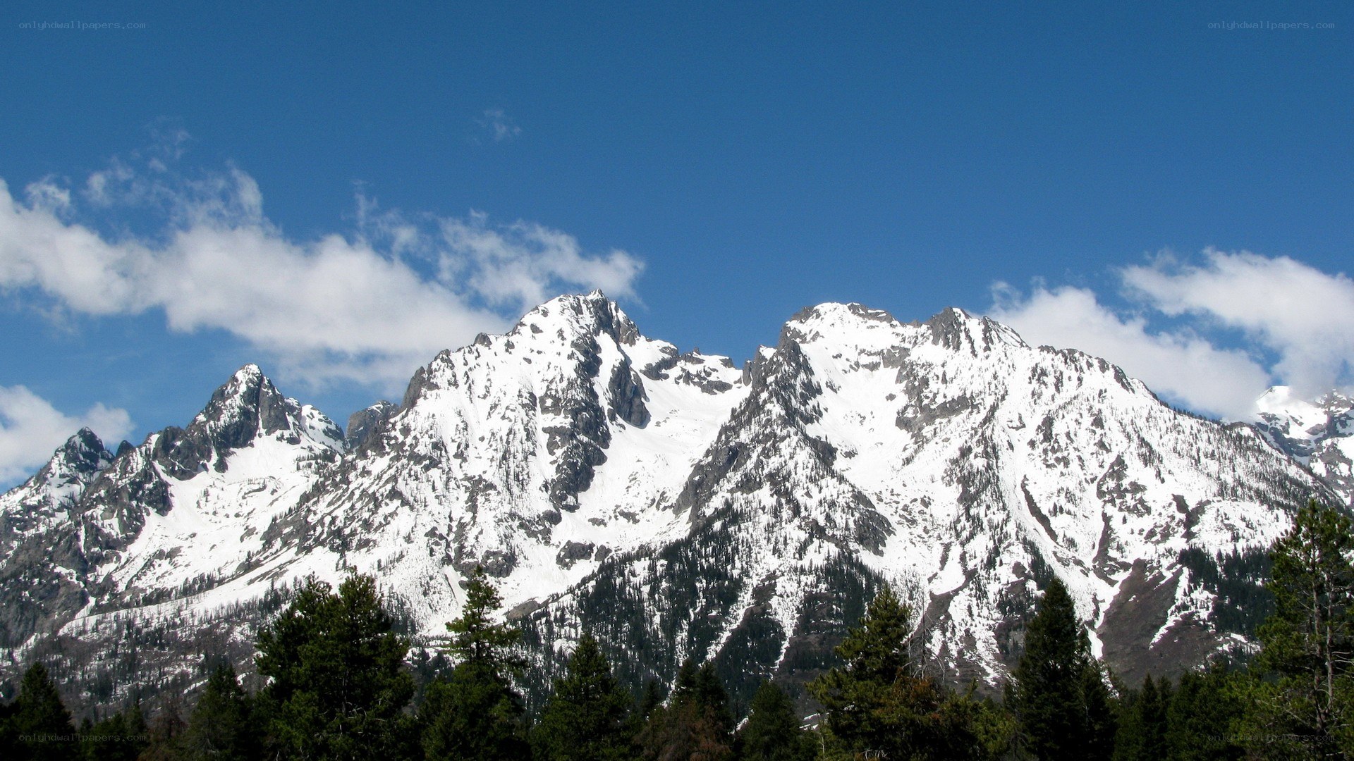 snow-capped mountains under blue sky