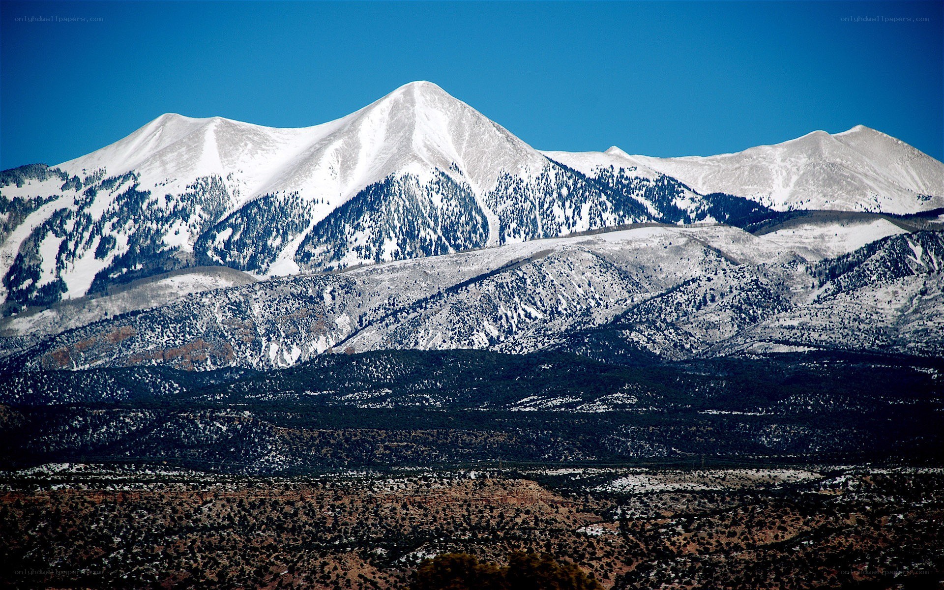 snow-capped mountains under blue sky
