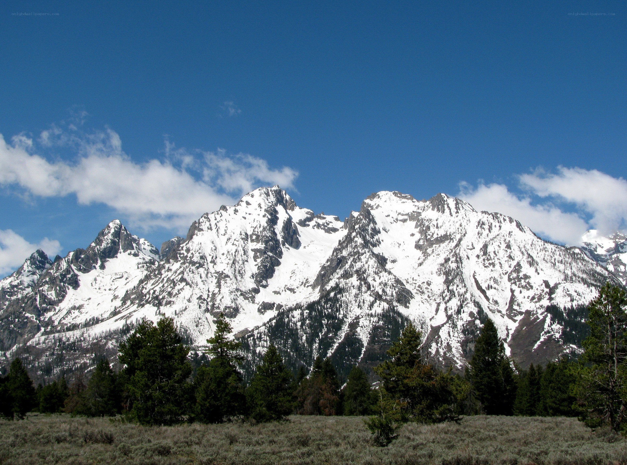 snow-capped mountains under blue sky