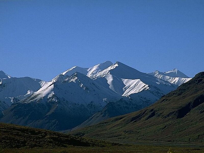 snow-capped mountains under blue sky