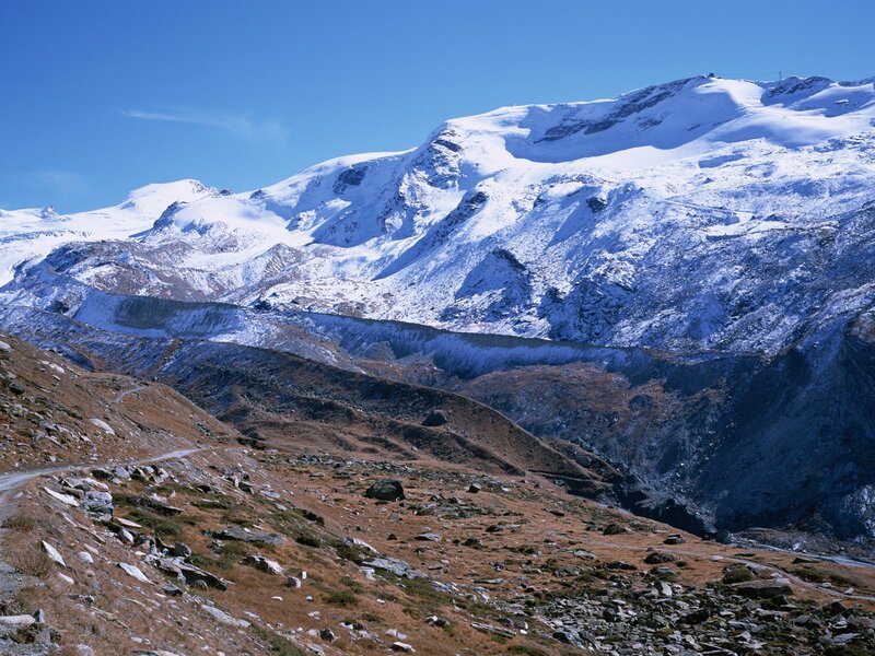 snow-capped mountains under blue sky