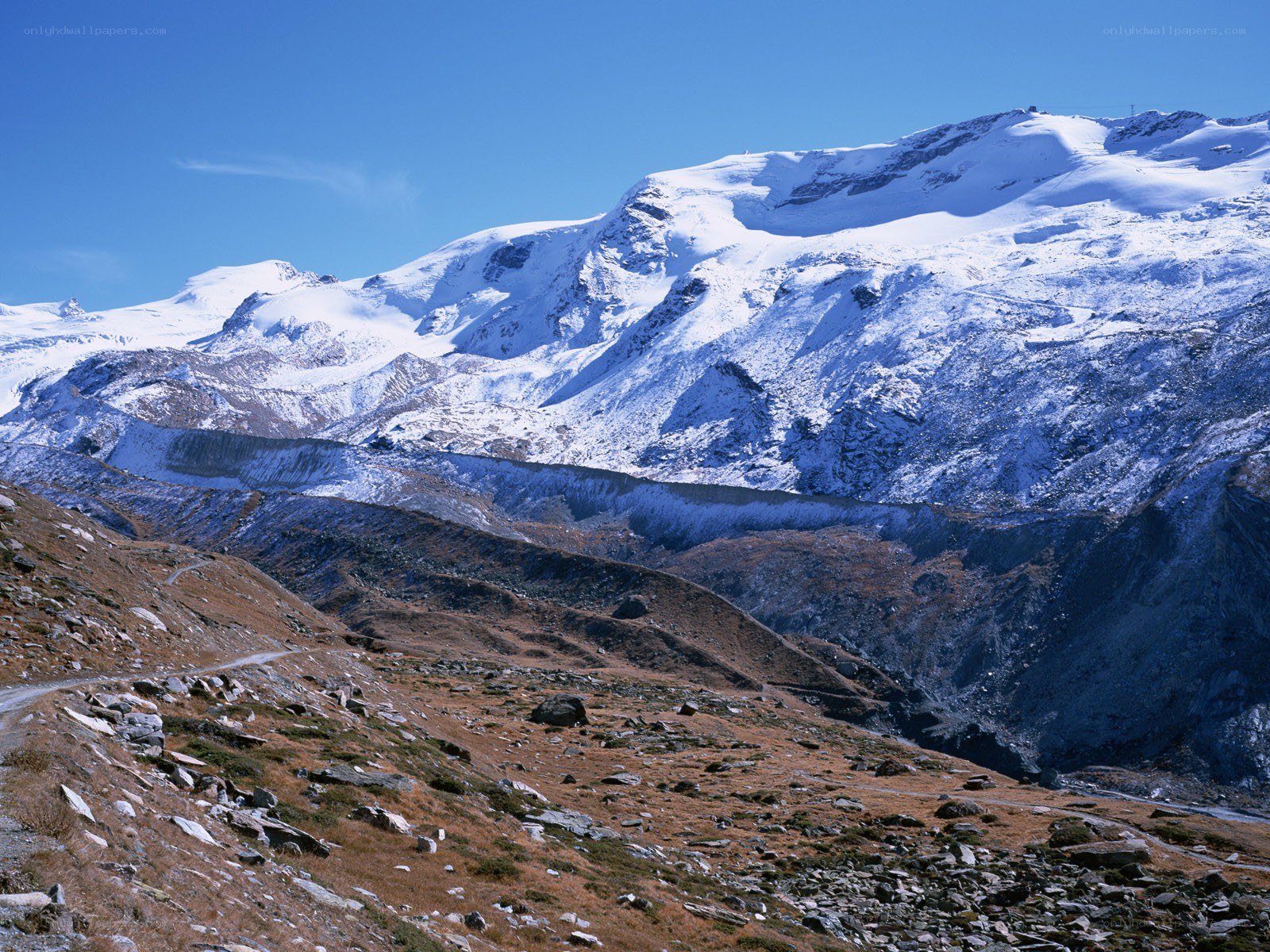 snow-capped mountains under blue sky