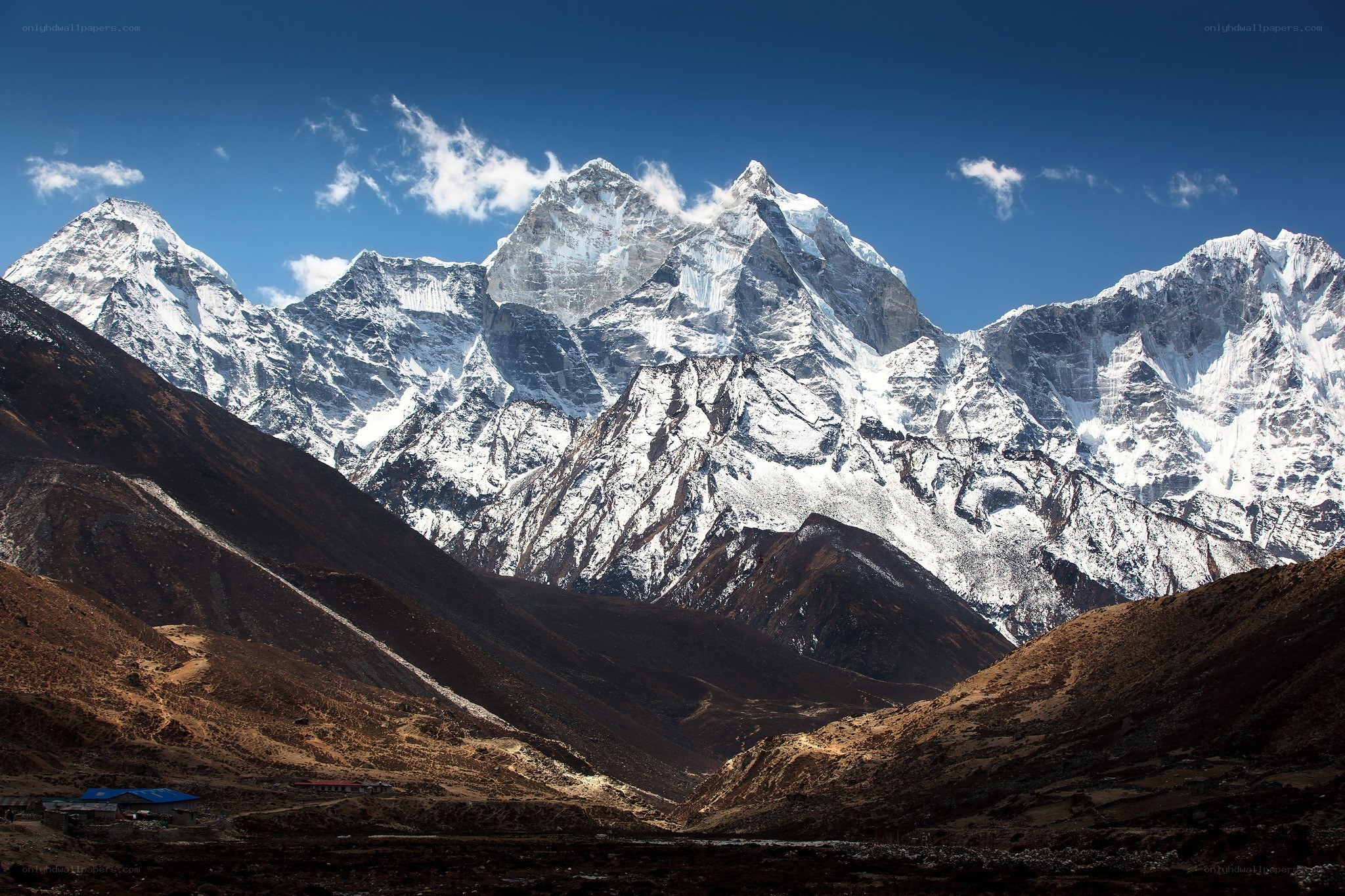 snow-capped mountains under blue sky