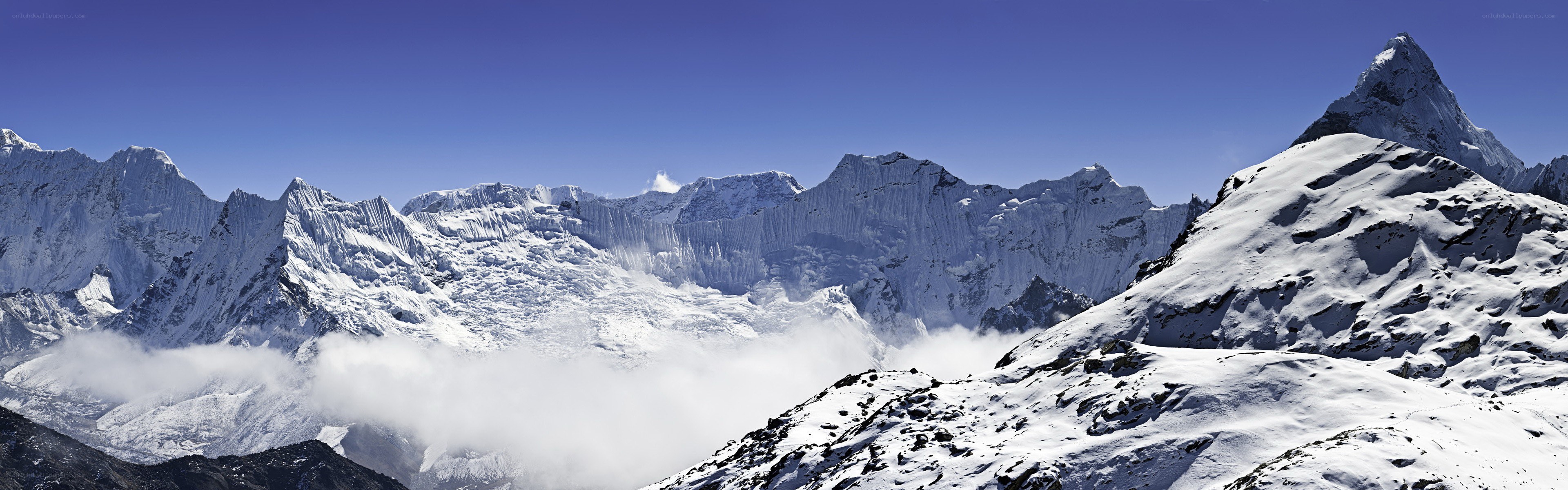 snow-capped mountains under blue sky