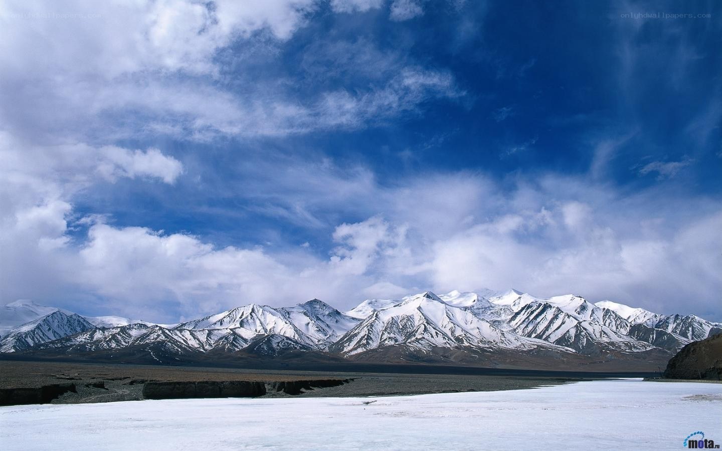 snow-capped mountains under blue sky