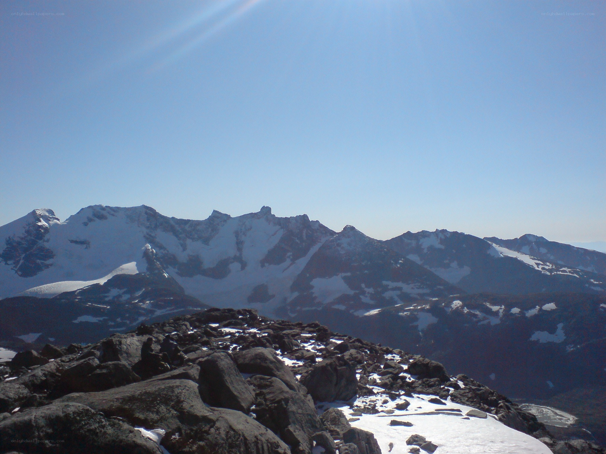 snow-capped mountains under blue sky