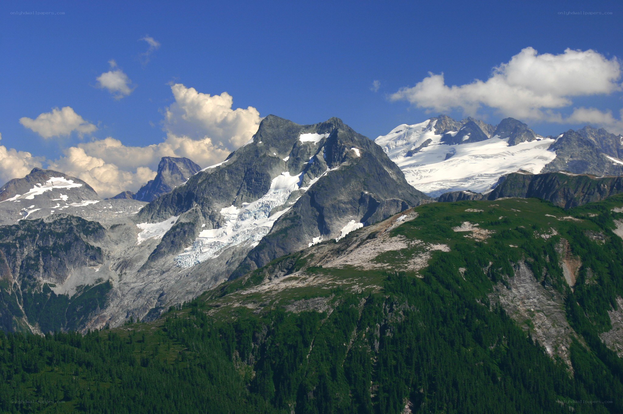 snow-capped mountains under blue sky