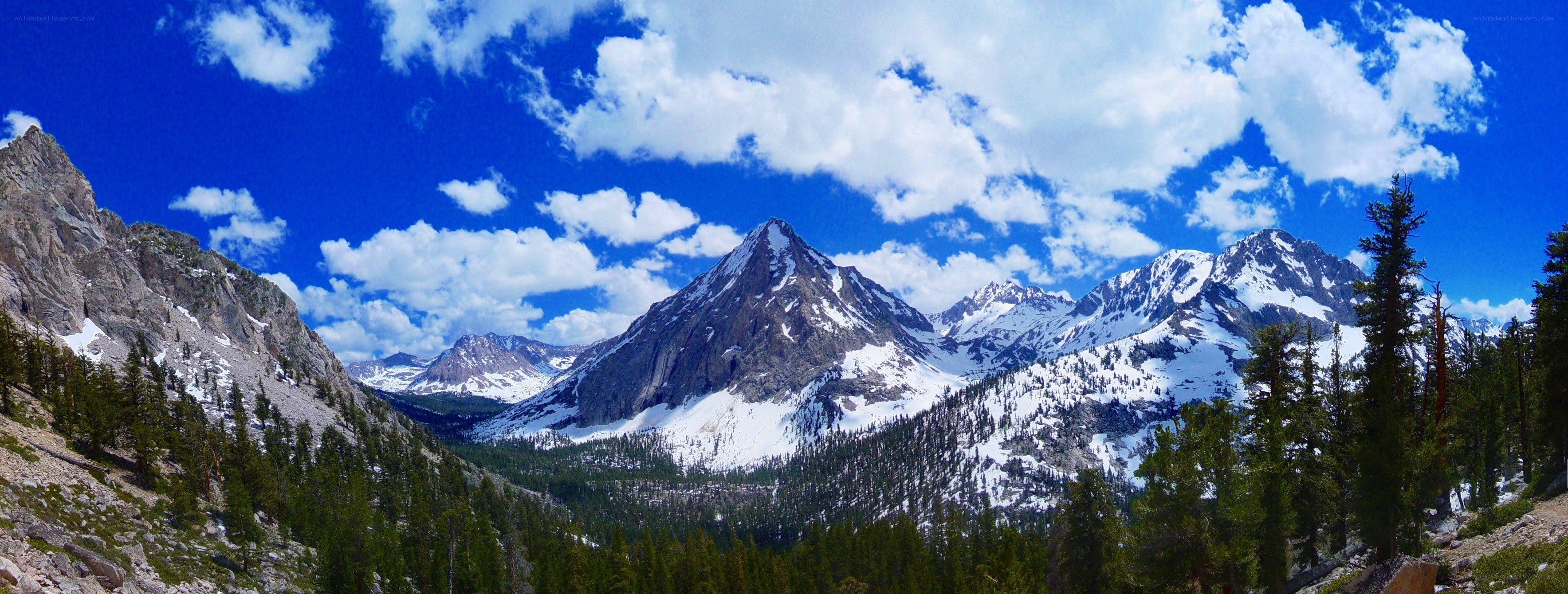 snow-capped mountains under blue sky