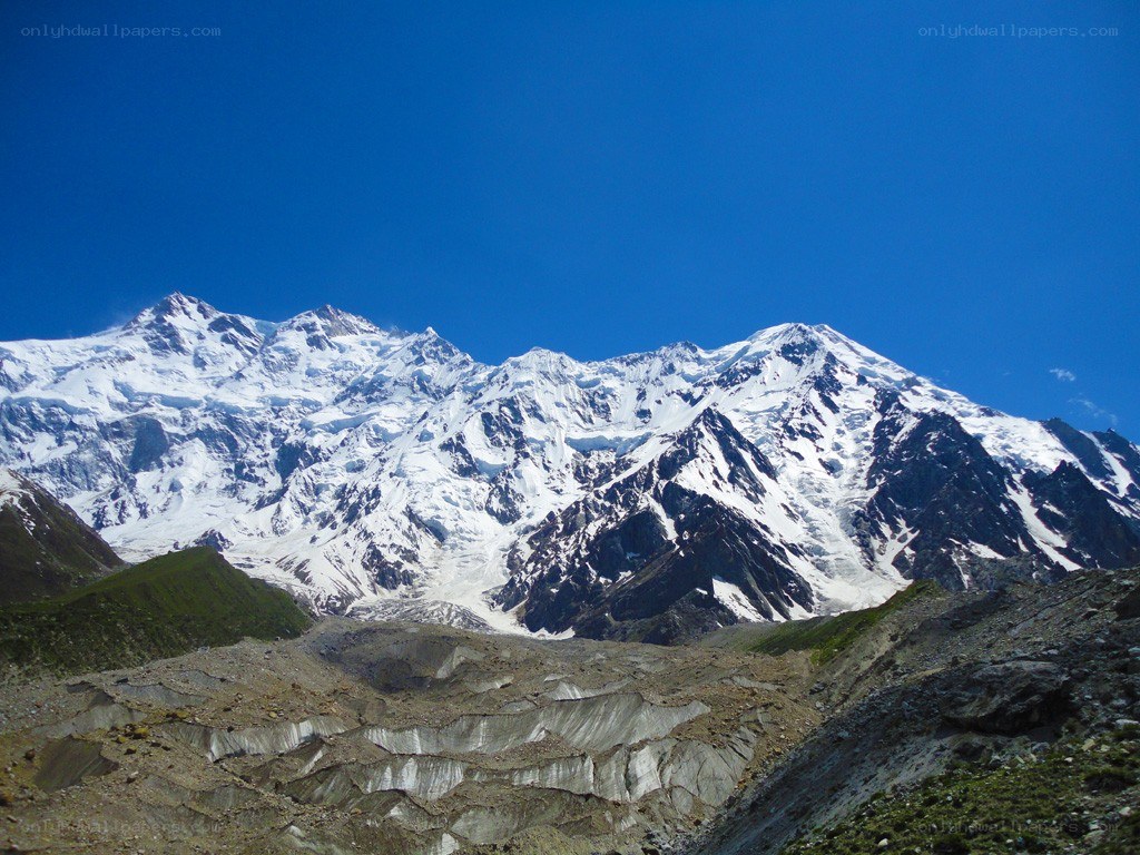 snow-capped mountains under blue sky