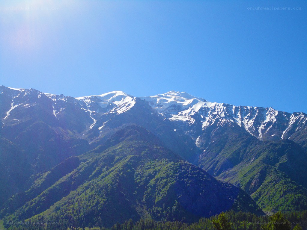 snow-capped mountains under blue sky