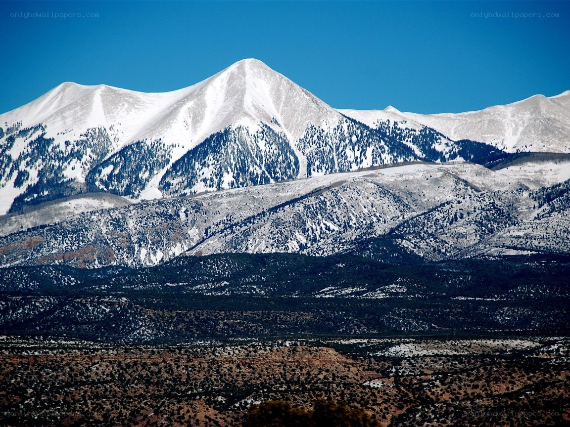 snow-capped mountains under blue sky